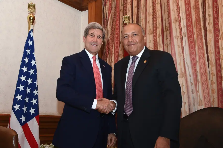 Secretary Kerry Shakes Hands With Egyptian Foreign Minister Shoukry Before Bilateral Meeting Amid Gaza Donors Conference in Cairo