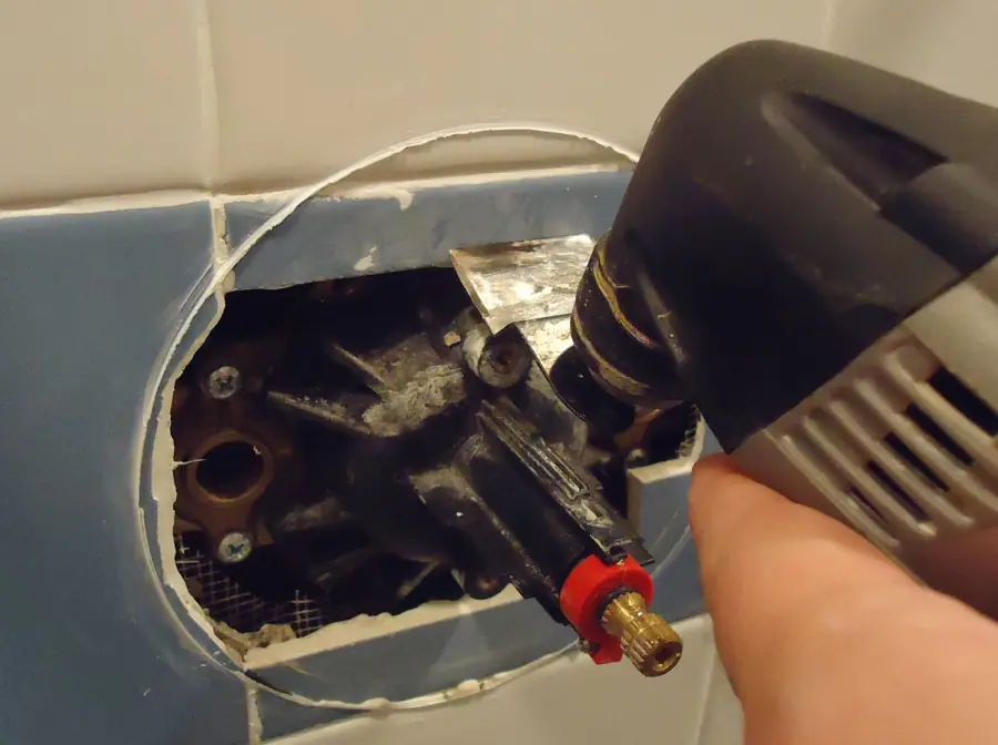 Kohler 306 diverter valve replacement using Dremel or Multimaster tool to remove part of tile