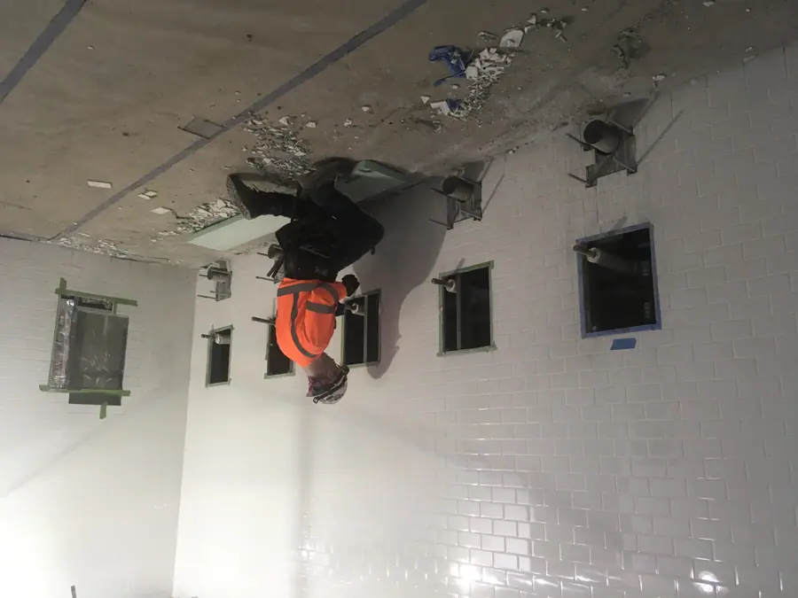 Preparing the plumbing for installation of toilets in a public bathroom in the future LIRR Concourse. 07-01-2019 (48266286392)