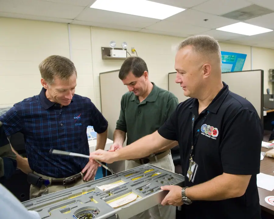 STS-135 crew training Tool-Repair Kits with instructor Jeff Stone